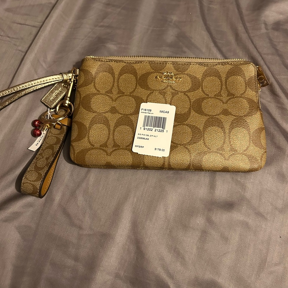 Brand new. Coach F16109 Large Wristlet Double Zip Khaki Chalk/platinum